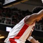 Arizona Wildcats and Purdue Boilermakers players clash in the NCAA Elite Eight basketball game for a Final Four berth