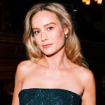 Brie Larson posing with a collage of her top IMDb-rated films including Room and Avengers: Endgame
