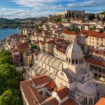 Historic stone streets and buildings in a Croatian coastal town like Šibenik, showcasing retirement lifestyle options