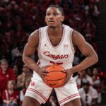 Houston Cougars guard Mercy Miller holding his CSC Academic All-District Team award