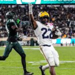Justice Haynes Michigan running back in game action