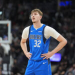 Dallas Mavericks and Portland Trail Blazers players during a game with injury concerns highlighted