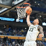 Michigan Wolverines forward Yaxel Lendeborg driving to the basket during an NCAA game