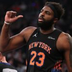 Mitchell Robinson New York Knicks center leading team huddle