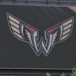 Philadelphia Wings lacrosse team logo and players on the field