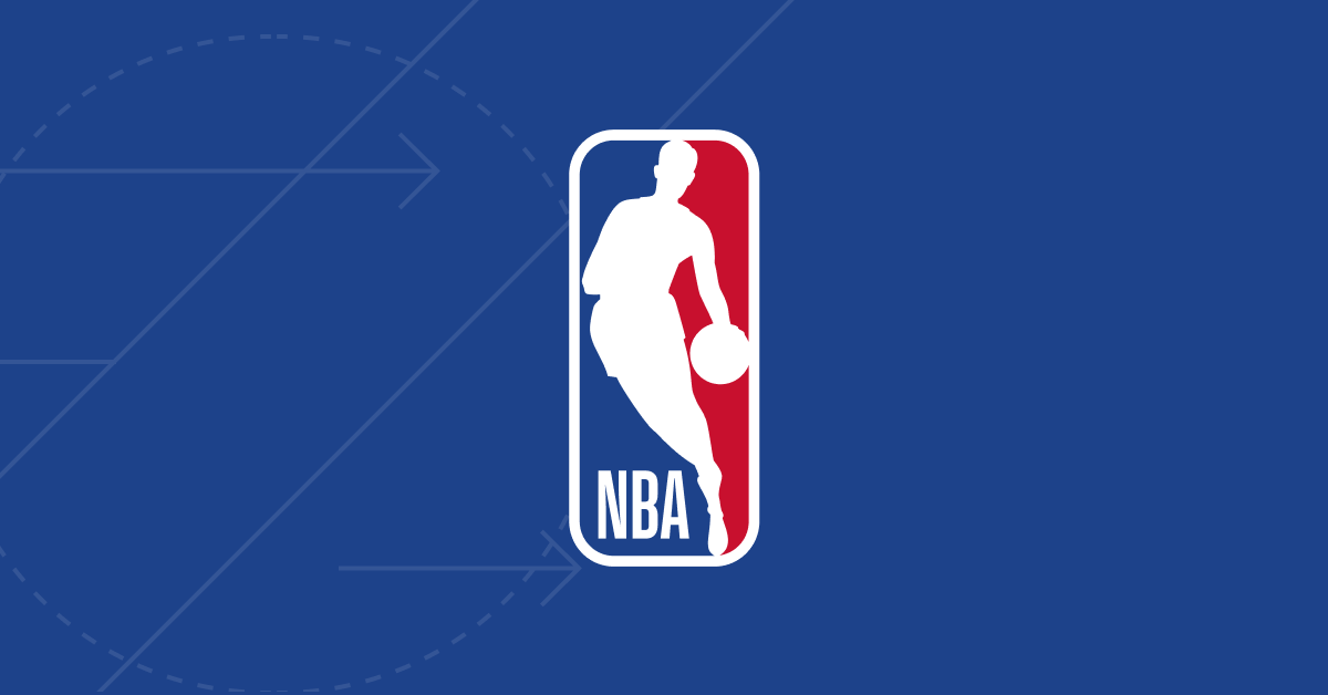Houston Rockets player driving to the basket against Memphis Grizzlies defense in close NBA game