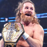 Sami Zayn celebrating with the WWE United States Championship belt on SmackDown