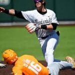 Mack Whitcomb celebrates his walk-off bunt to win the 16-inning SEC game for Vanderbilt over Tennessee at Hawkins Field