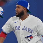Vladimir Guerrero Jr. batting stance in Blue Jays uniform, poised for a big game against the Colorado Rockies