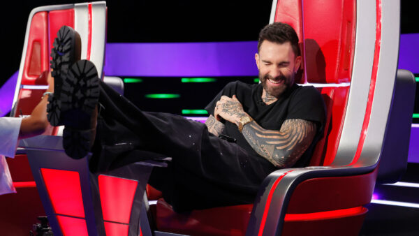 Adam Levine showing off his new bleached blonde buzz cut on The Voice set