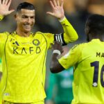Cristiano Ronaldo and Al-Nassr players in action during a Saudi Pro League match against Al-Ettifaq