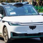 Baidu Apollo Go robotaxi fleet immobilized on a street in Wuhan during a major system failure