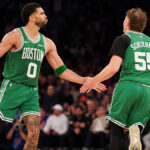 Baylor Scheierman in Celtics uniform during a 2026 game, central to bold playoff predictions