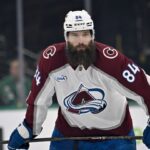 Colorado Avalanche defenseman Brent Burns celebrates his 1000th consecutive NHL game milestone