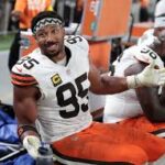 Cleveland Browns GM Andrew Berry and Myles Garrett at a press conference discussing team defense