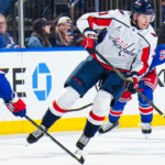 Washington Capitals vs New York Rangers players clash in a crucial late-season Metropolitan Division NHL game