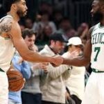 Boston Celtics stars Jayson Tatum and Jaylen Brown celebrating a play during a game