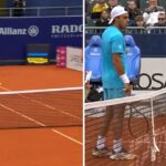 Francisco Cerúndolo corrects an electronic line call during his ATP Munich match against Sumit Nagal