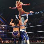 Charlotte Flair in the ring, rejecting retirement talk and stating she's in her prime