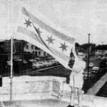 Historic photo of the iconic Chicago city flag with two blue stripes and four red stars