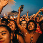 Coachella 2026 festival grounds at night with crowd and stage lights