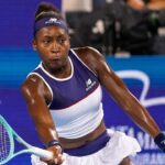 Coco Gauff smiling confidently with her natural 4C hair in the Miu Miu advertisement