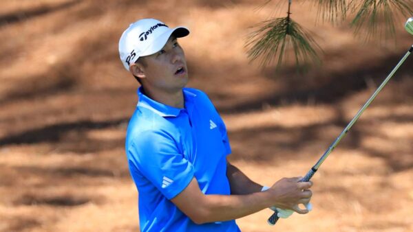 Collin Morikawa playing a shot during the Masters first round, battling mental scars from injury