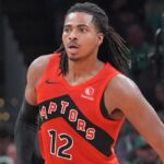 Toronto Raptors rookie Collin Murray-Boyles driving to the basket during an NBA game