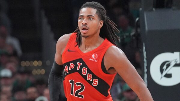 Toronto Raptors rookie Collin Murray-Boyles driving to the basket during an NBA game