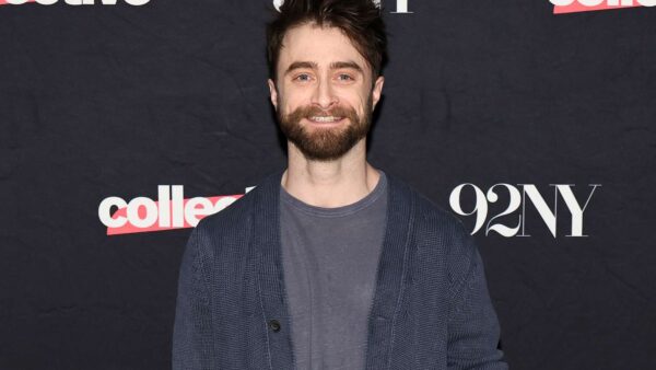 Daniel Radcliffe smiling, discussing Harry Potter career autonomy on a podcast