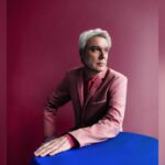 David Byrne performing live on stage at Stanford University's Frost Amphitheater