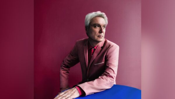 David Byrne performing live on stage at Stanford University's Frost Amphitheater