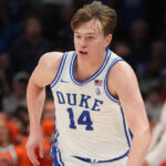 Duke transfer forward Nikolas Khamenia in a UConn Huskies uniform graphic