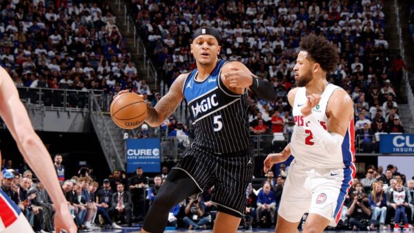 ESPN analyst discussing NBA playoffs betting tips and fantasy basketball picks on screen