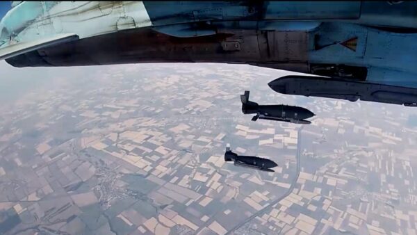 Experts analyzing map of Europe, discussing Russia's air force threat to NATO