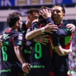 FC Juárez players in action during a crucial Liga MX match for a playoff spot