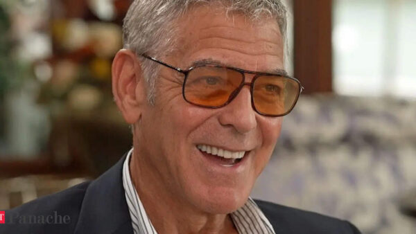 George Clooney smiling in a candid interview about aging as a privilege