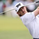 PGA Tour golfer Jake Knapp wearing Anaheim Ducks sponsorship logo at a golf tournament