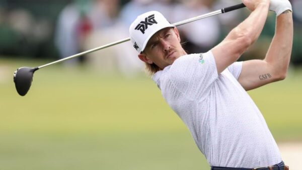 PGA Tour golfer Jake Knapp wearing Anaheim Ducks sponsorship logo at a golf tournament
