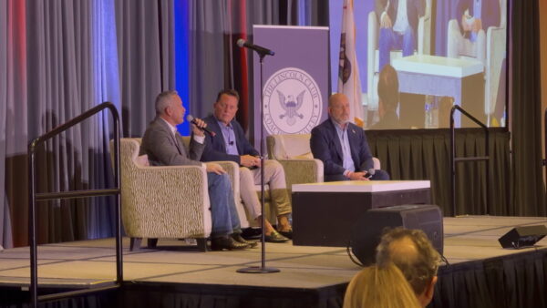Steve Hilton and Chad Bianco debate on stage at the California GOP gubernatorial forum in Rancho Mirage