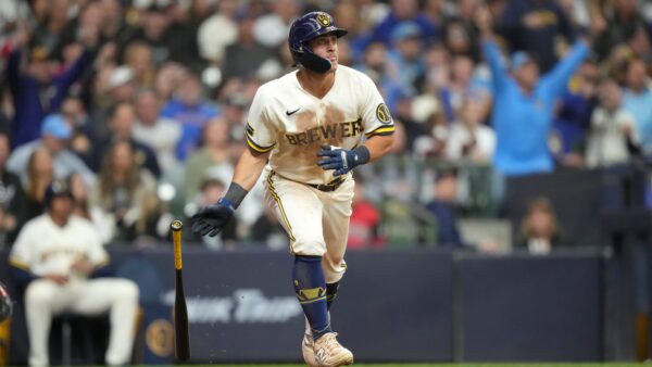 Milwaukee Brewers vs Boston Red Sox players at bat during Fenway Park series opener