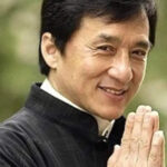 Jackie Chan posing, symbolizing his rejection of the Bruce Lee clone label and unique action legacy