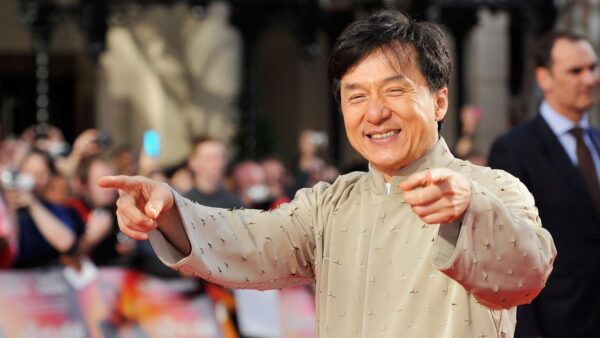 Jackie Chan smiling at age 72, celebrating his birthday and cinematic legacy