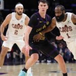 Jake LaRavia playing defense for the Los Angeles Lakers during their 10th straight home win