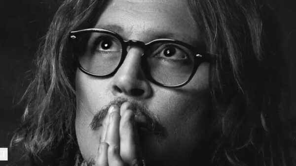 Johnny Depp smiling, reflecting on his quote about the liberating aspects of aging