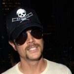 Johnny Knoxville posing in casual yet stylish attire as an unexpected men's fashion icon
