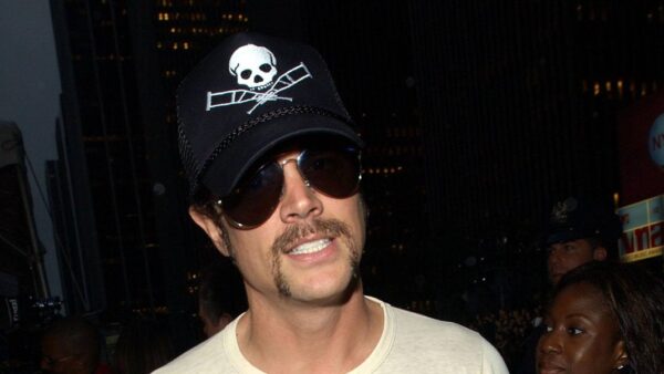 Johnny Knoxville posing in casual yet stylish attire as an unexpected men's fashion icon