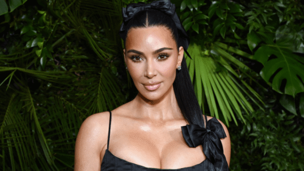 Kim Kardashian wearing a vintage ivory Roberto Cavalli slip dress with a plunging neckline and pink fur stole for Easter