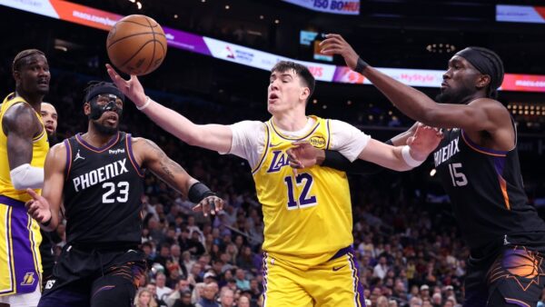 LeBron James and Devin Booker in Lakers vs Suns NBA game action at Crypto.com Arena