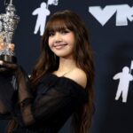 Lisa smiling on stage, announced as first K-pop artist for Las Vegas residency at Caesars Palace